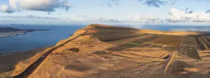 Deserted Coastal Area Spain Drucke: Road on cliffs in evening light