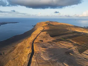 Evening Light On Coast Drucke: Road on cliffs in evening light