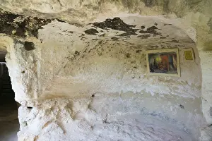 Medieval Rock Monastery Drucke: A rock cave with a mural and an information panel