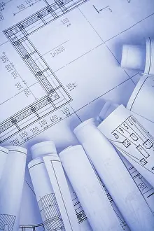 Construction Plan Drucke: Rolled blueprints with organized copyspace