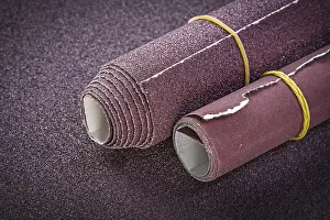 Construction Industry Equipment Drucke: Rolled up sand paper top view abrasive tools