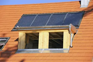 Stainless Steel Roofing Materials Drucke: Roofer working on a new dormer window
