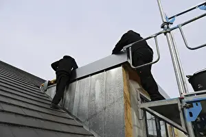 Construction Site Worker Drucke: Roofer working on a new dormer window