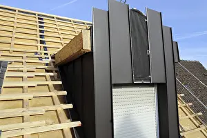 Construction Site Worker Drucke: Roofer working on a new dormer window