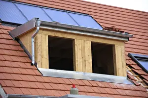 Stainless Steel Roofing Drucke: Roofer working on a new dormer window