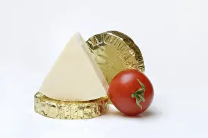 Cheese Nutrition Facts Drucke: Round and triangular processed cheese with tomato