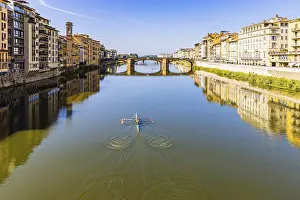 Southern Europe Recreational Activities Drucke: Rowers training on the river Arno