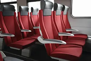 Rail Traffic Transport Drucke: Rows of red seats in modern train