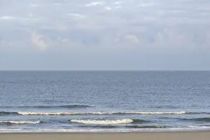 Northern Germany Coastal Area Drucke: Running out waves at the sandy beach