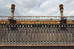 Zeche Zollverein Essen Drucke: Rusted industrial structure under a cloudy sky