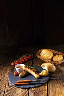 European Cuisine Drucke: Rustic bratwurst with ketchup and fresh rolls