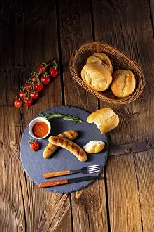 German Food Photography Drucke: Rustic bratwurst with ketchup and fresh rolls