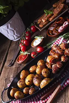 Speciality Food Photography Drucke: Rustic dates wrapped in bacon and young roasted potato
