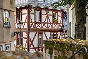 Historic Half Timbered Building Drucke: Rustic half-timbered building with wooden elements and lantern