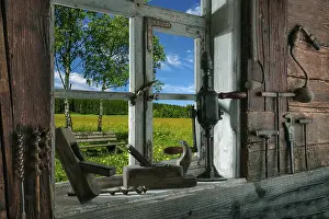 Black Forest Landscape Drucke: Rustic workshop with old tools and view out of the window into the landscape