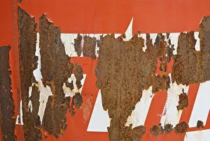 Deserted German Scene Drucke: Rusty surface with peeling red paint and white stripes