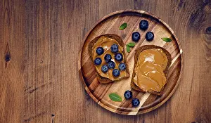 Rye Bread With Peanut Paste Drucke: Rye bread with peanut paste and fresh blueberries