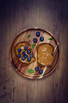 Homemade Rye Bread Drucke: Rye bread with peanut paste and fresh blueberries