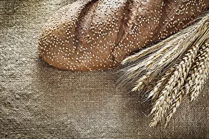 Deserted Bakery Scene Drucke: Rye ears bread on burlap background