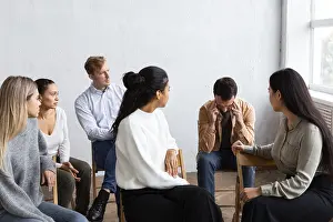 Group Therapy Session Drucke: Sad man talking about his issues group therapy session