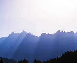 Western Alps Landscape Drucke: Saentis mountain range, silhouetted with sun rays