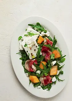 Fresh Fruit And Cheese Platter Drucke: Salad, melon with prosciutto, arugula