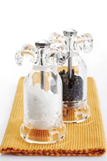 Spice And Nutrition Drucke: Salt and pepper mill on orange table setting