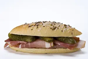 Food Still Life Studio Shot Drucke: Salted roll with ham and pickles