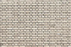 Deserted Brick Wall Background Drucke: Sand dollar colored brick wall background