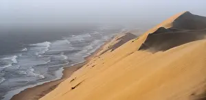 Namib Naukluft Park Drucke: Sand dunes with wave patterns and sea in evening light