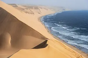 Natural Reserve Landscapes Drucke: Sand dunes with wave patterns and sea in evening light