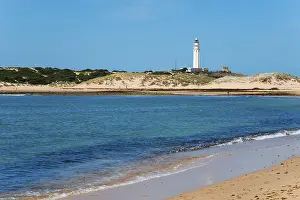European Coastlines Photography Drucke: Sandy beach beach with lighthouse in the background