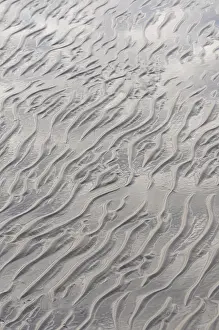 Sandy Beach At Low Tide Drucke: Sandy beach at low tide, rippled wave pattern