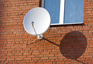 Satellite Dish Installation Drucke: Satellite Dish mounted on brick wall