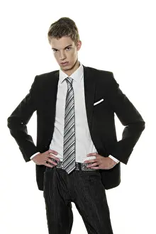 Young Man In Suit Drucke: A sceptical young man in the studio