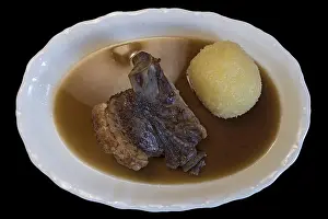 Southern Germany Cuisine Drucke: Schauferle with dumpling on black background