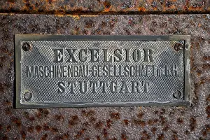 Namibia Architecture Drucke: Schild Excelsior an einem alten Wassertank