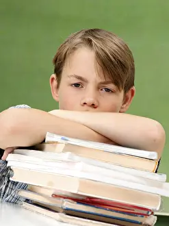 Schoolboy With Books Drucke: Schoolboy with a stack of books