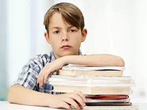 Caucasion Ethnicity Head Shot Drucke: Schoolboy with a stack of books, looking serious