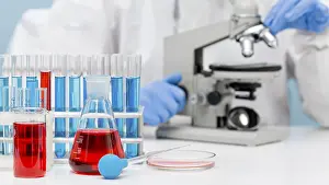 Medical Research And Development Drucke: Scientist checking substance with microscope