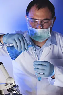 Test Tube Analysis Drucke: Scientist is doing research at the work