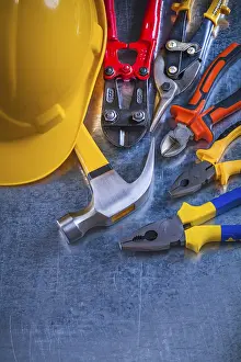 Construction Industry Symbol Drucke: Scratched metallic background with variation of construction tools maintenance concept