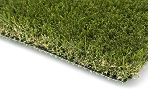 White Background Studio Drucke: Section of artificial turf grass on white background