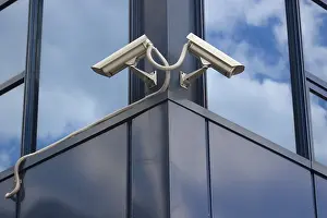 CCTV Camera Installation Drucke: Two security cameras on the corner of a building