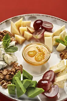 Artistic Food Photography Drucke: Selection of fine cheeses with crispy walnuts
