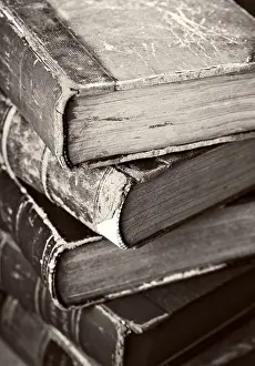 Deserted Studio Shot Drucke: Sepia toned image of a stack of old worn books