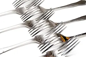 Empty Dinner Table Drucke: A series of forks lined up for dinner