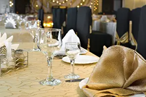 Deserted Dinner Table Scene Drucke: A served restaurant table, golden interior