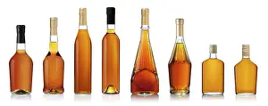 Grape Vine Cultivation Drucke: Set of brandy bottles isolated on white background