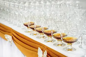 Whisky And Liquor Display Drucke: Set of brandy glasses at buffet table